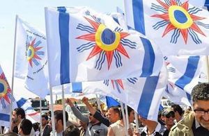 Chaldeans with Chaldean Flag.jpg